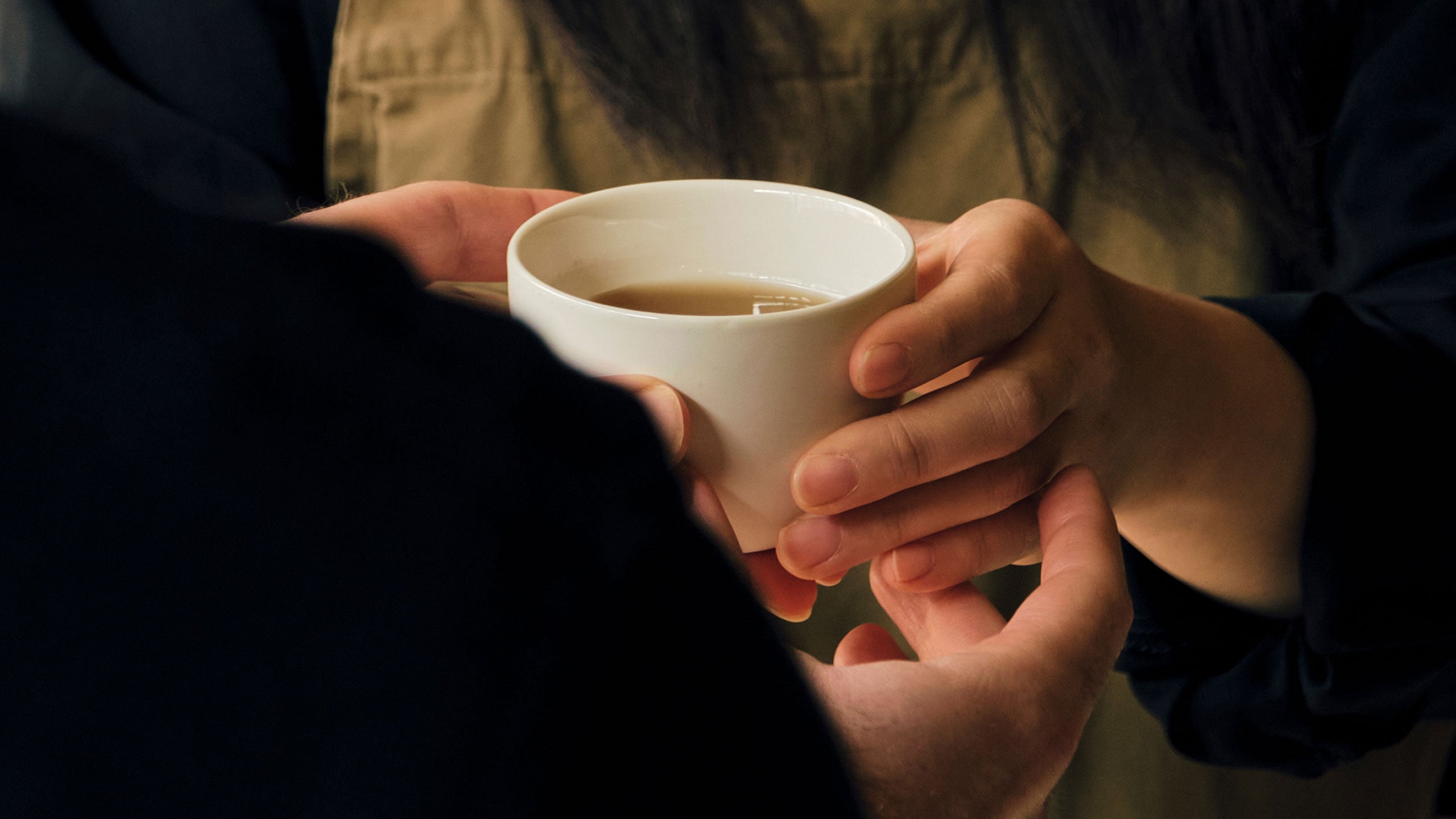 Aesop employees share a cup of tea