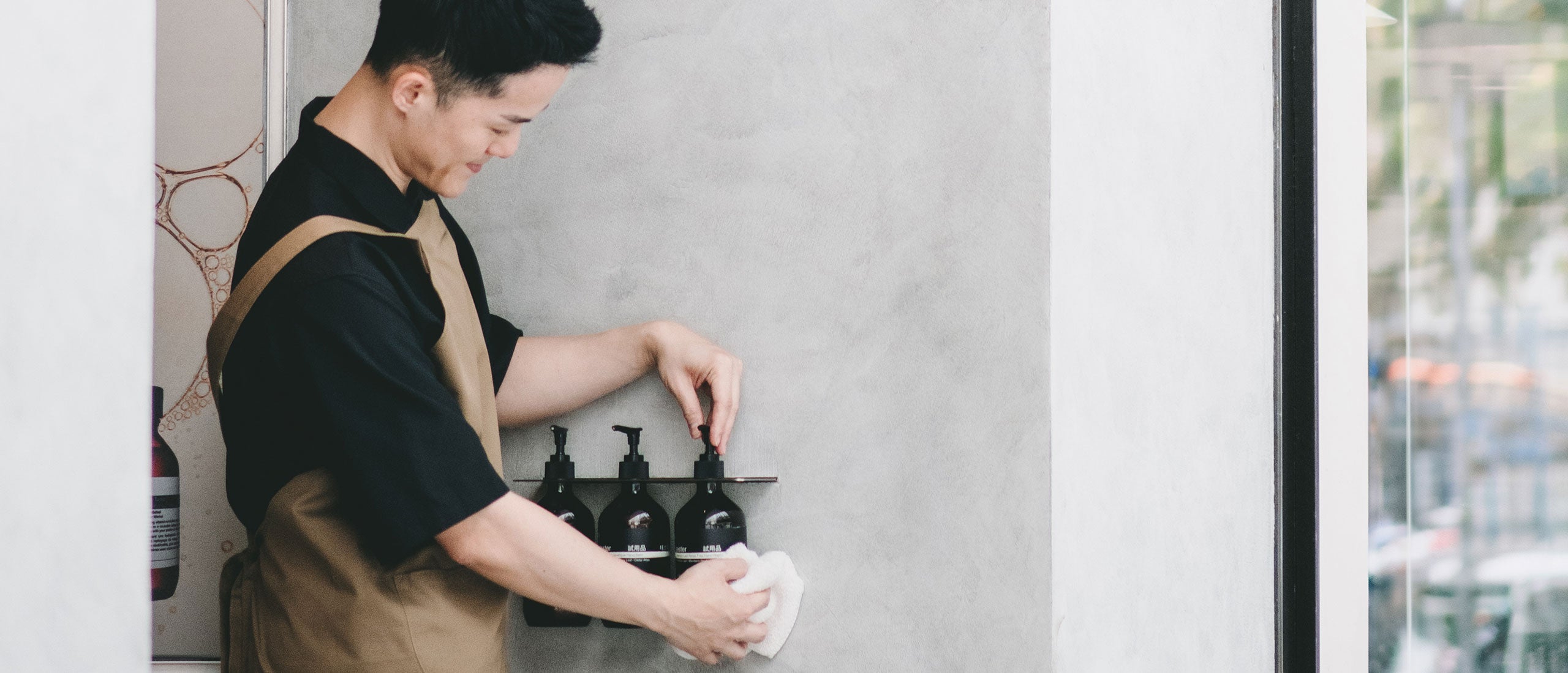 An Aesop consultant performs routine checks of in-store product testers.