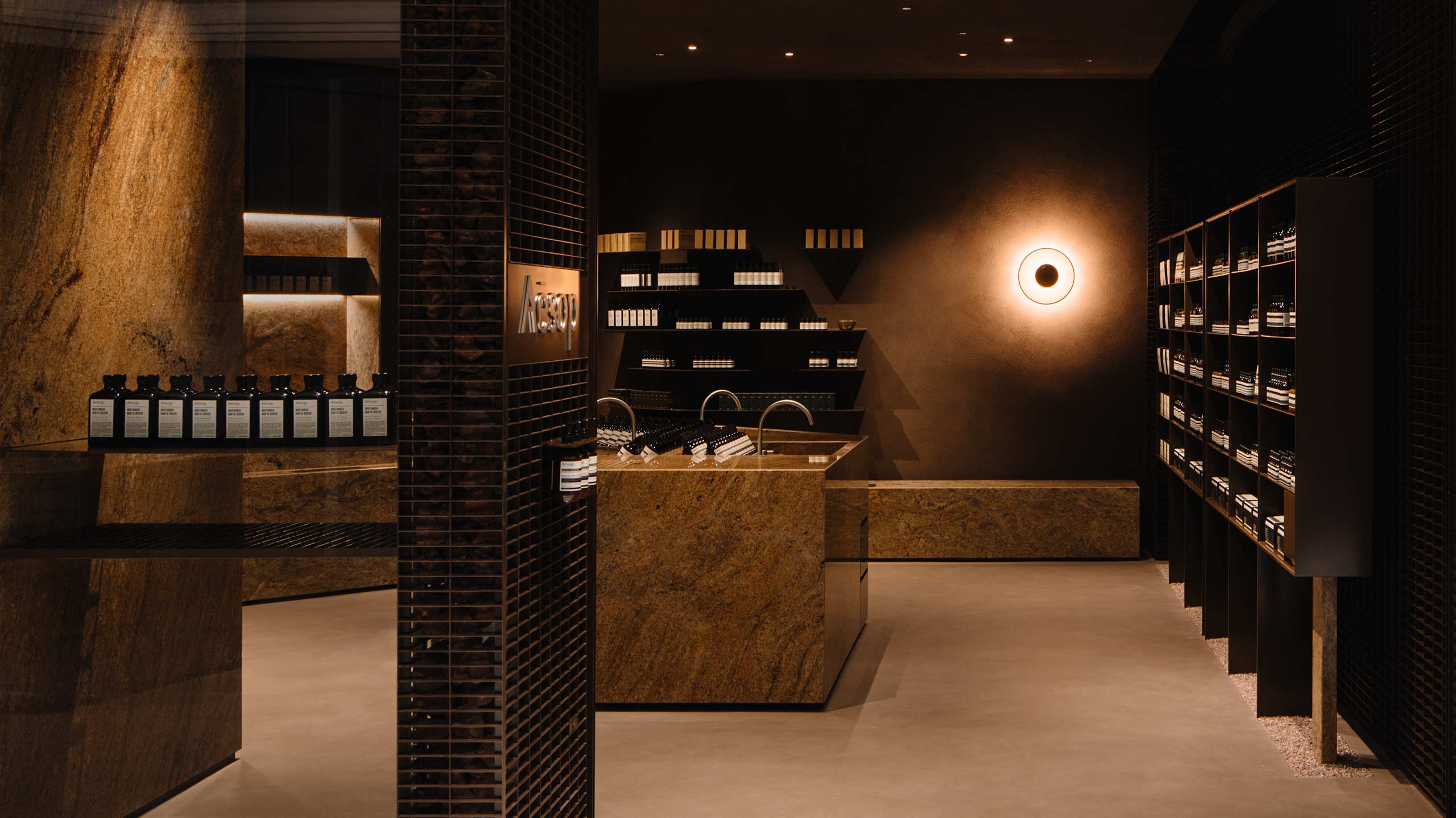 The stores dark interior is crafted from elements of brass and marble