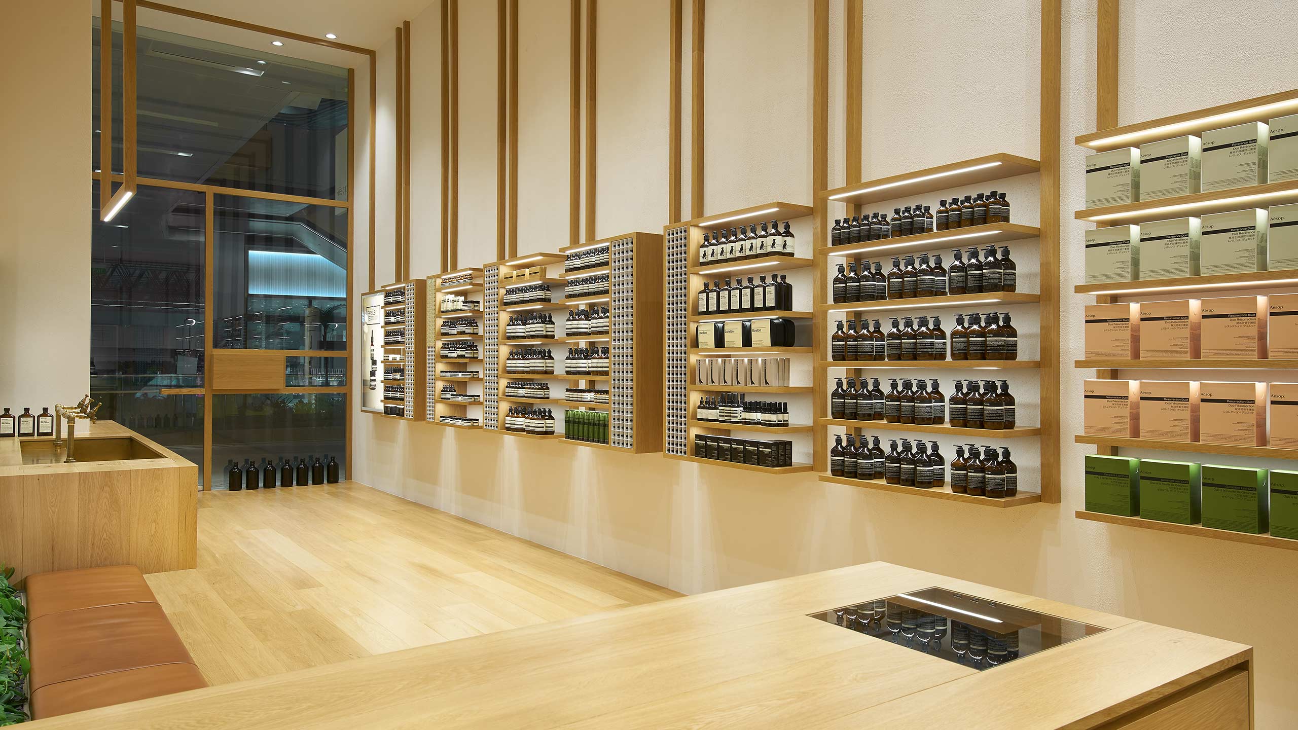 Aesop Westgate store interior featuring products on wooden shelves.